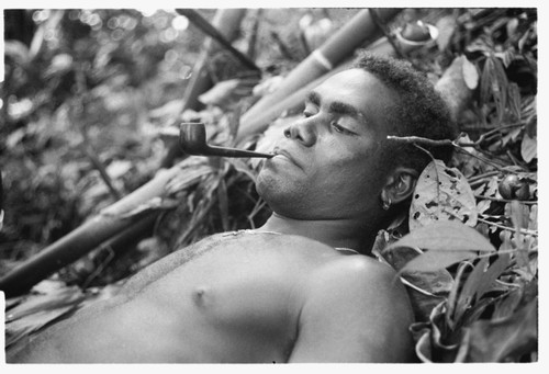 Man, Bikinemu perhaps, lying down in shrine