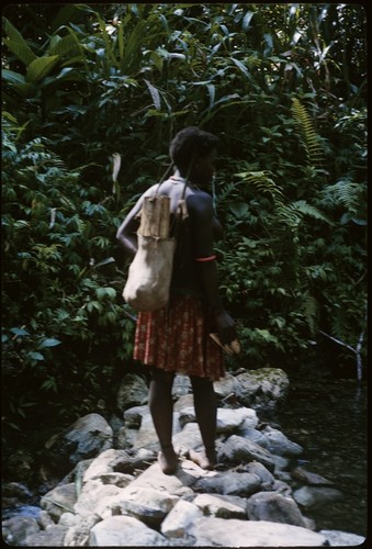 Woman standing on stones