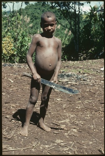 Young boy with bushknife