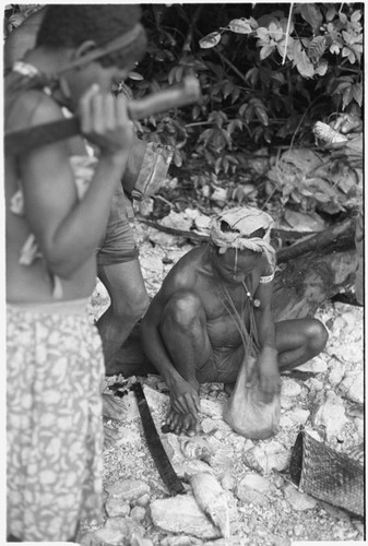 Man pulling out fish for market