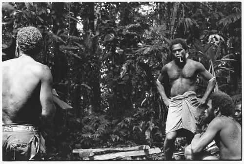 Men in shrine for pig sacrifice