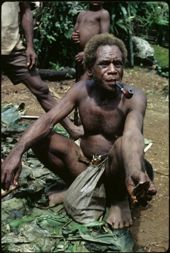 Man sitting on a mat