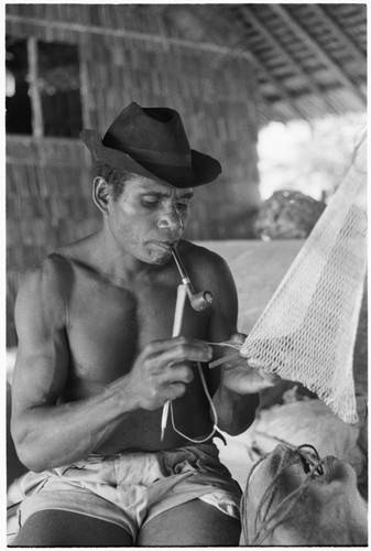 Nene'au So'ogeni making 'abe net for catching birds and bats