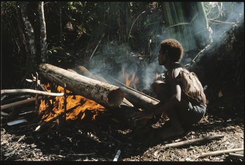 Heating log to remove bark