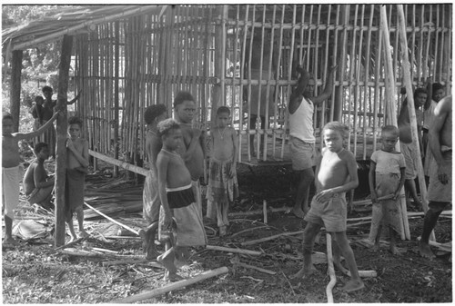 Group of people in front of house under construction