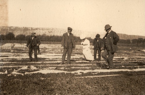 Polhemus family members viewing fruit drying at Coyote Ranch