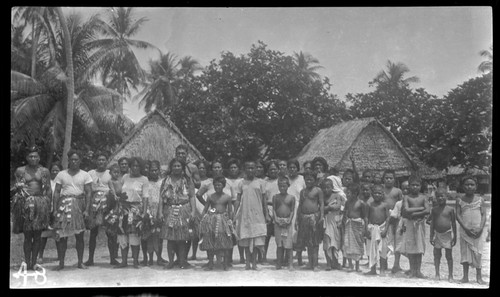 Group in front of houses