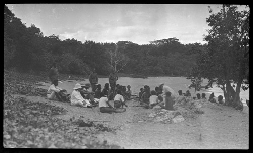 Officers, and a group of men on the beach