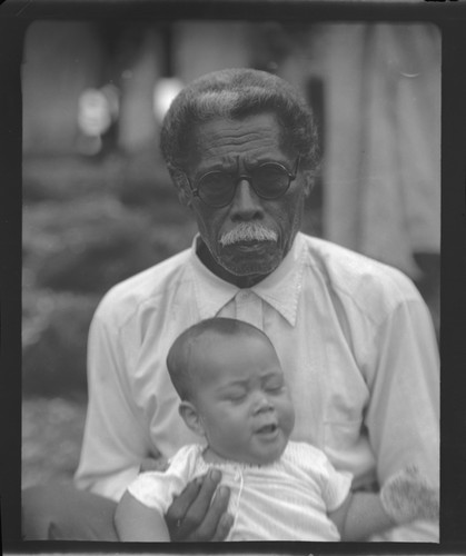 Portrait of man with infant