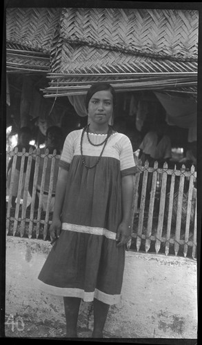 Girl in front of house