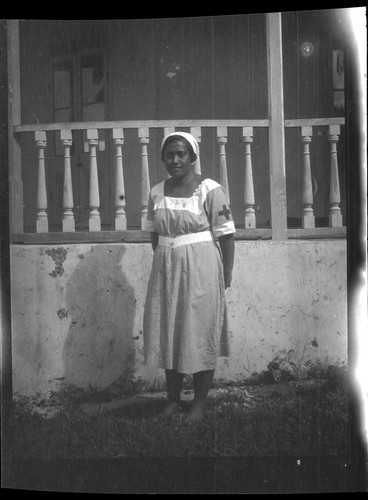 Portrait of nurse in front of building