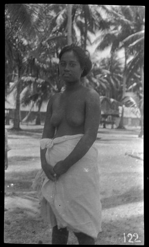 Young woman with village in background