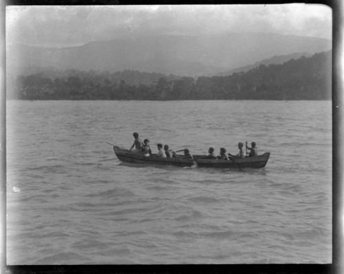 Several men on canoe