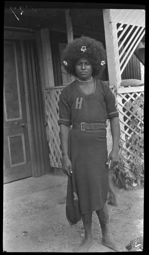Malaga, one of Lambert's assistants in Papua; H on uniform stands for Hookworm