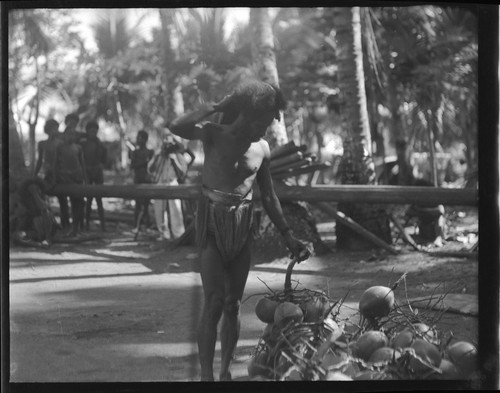 Man holding coconut