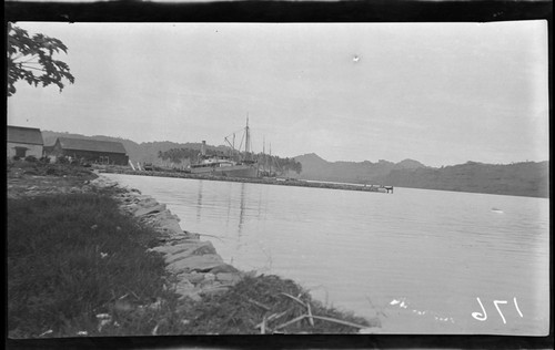 Distant view of ship and buildings