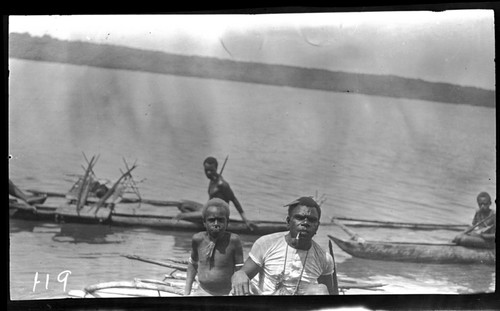 Man and boy in canoe, Santa Cruz