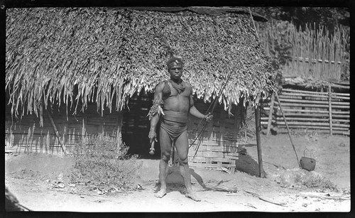 Man in front of house