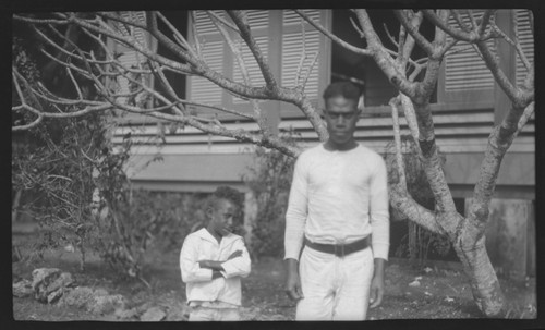 Man and boy near a building