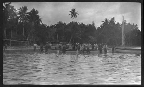 Men in a boat at shore