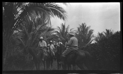 European men on horses; Lambert on right