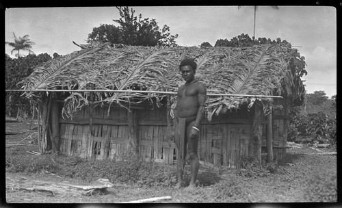 Man in front of house