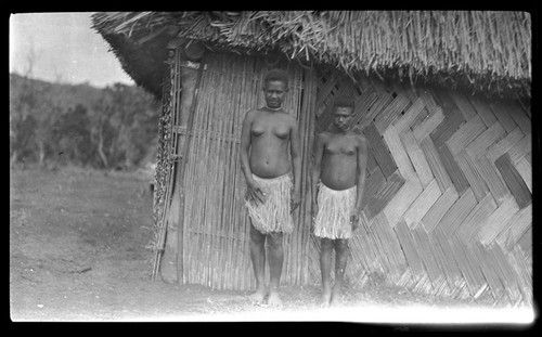 Two young women near a house