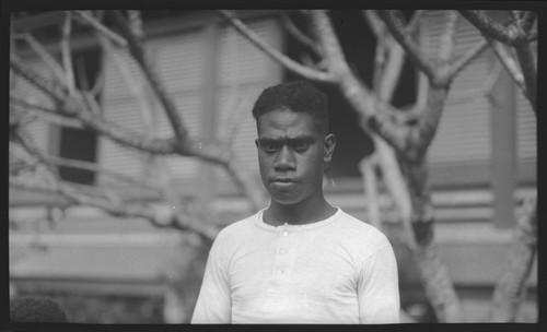 Young man in front of a building