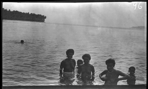 Group of children and adults inside beach