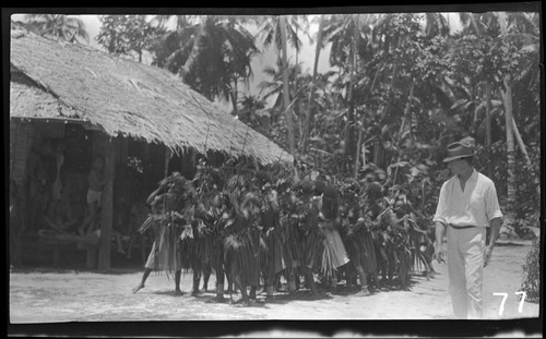 Preparing to dance, European man walking beside group