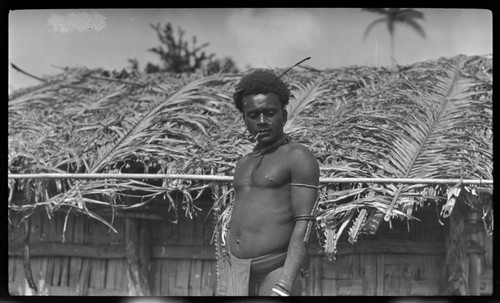 Man standing by house