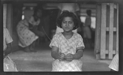 Cook Islands girl weaving on steps of school, Avarua, Rarotonga