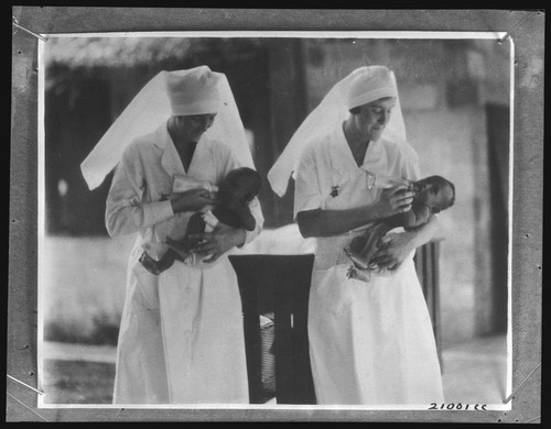 Nurses feeding infants