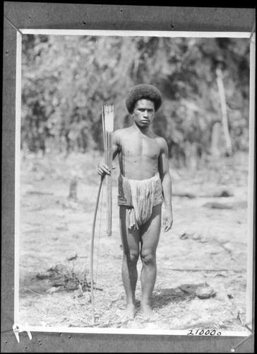 Buia, holding human bone tipped arrows