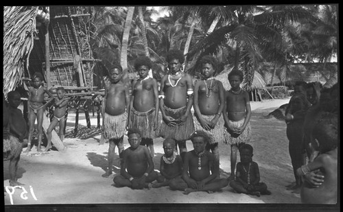 Young people near a house, probably at Chiria, Yule Island