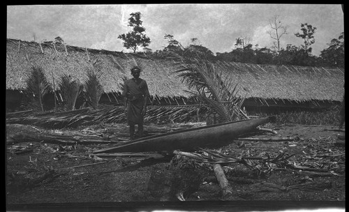 Man by a long men's house