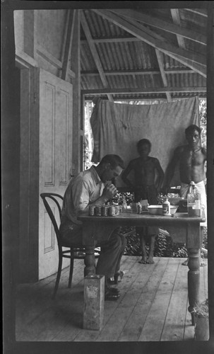 European man checking samples for hookworm