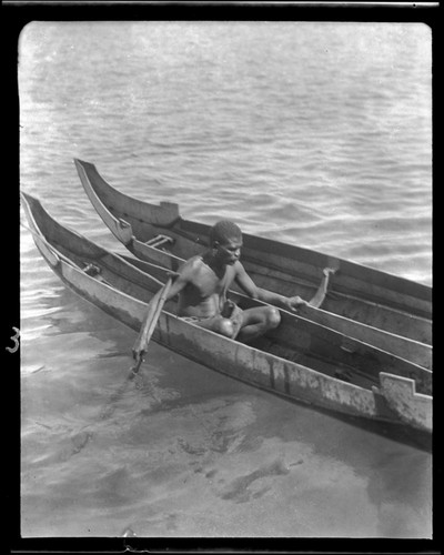 Man with canoes, Tai Lagoon, Malaita