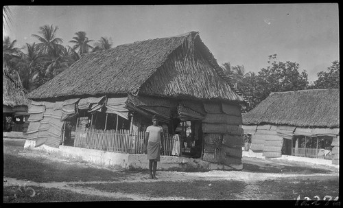 Man in front of house