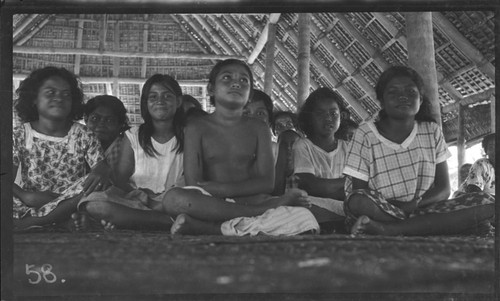 Girls inside a meeting house