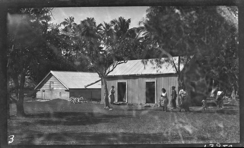 Cistern for water supply on the left, in Tonga village