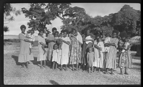 Women holding children