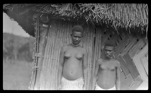 Two young women near a house