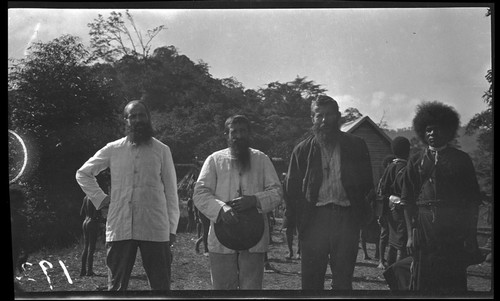 Priests, and one of Lambert's assistants at a Catholic mission in mountains of Central Province