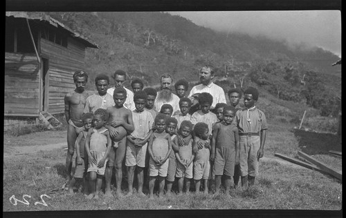 Priest Paul Fastre with children at Popole Mission