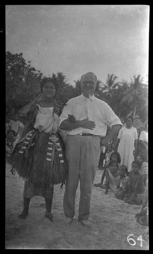 Lambert and woman surrounded by group