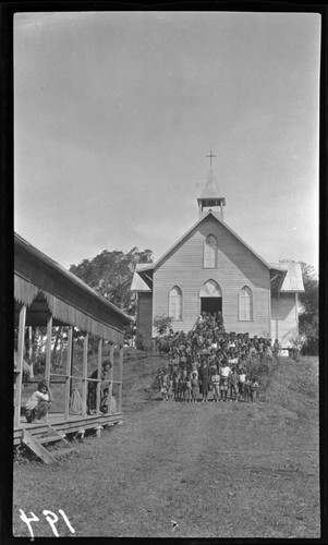 People outside a church at Dilava, a Catholic mission to Mafulu people, in the mountains of Central Province