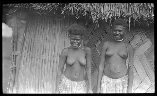 Young women outside a house