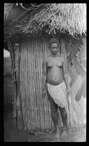 Young woman near a house