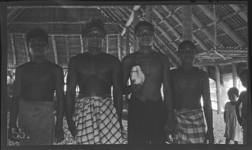 Men and boys inside a meeting house